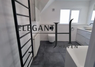 Luxury bathroom renovation with custom vanity and tiles in South London