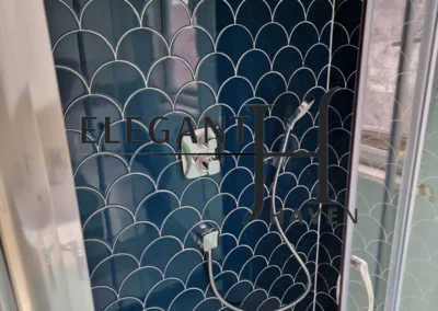 Walk-in shower and luxury tiles in a bathroom makeover project.
