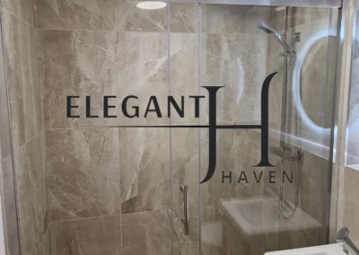 Bathroom refurbishment in London featuring elegant fixtures and marble tiles.