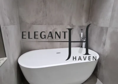 Bespoke bathroom makeover with marble finishes and glass shower.